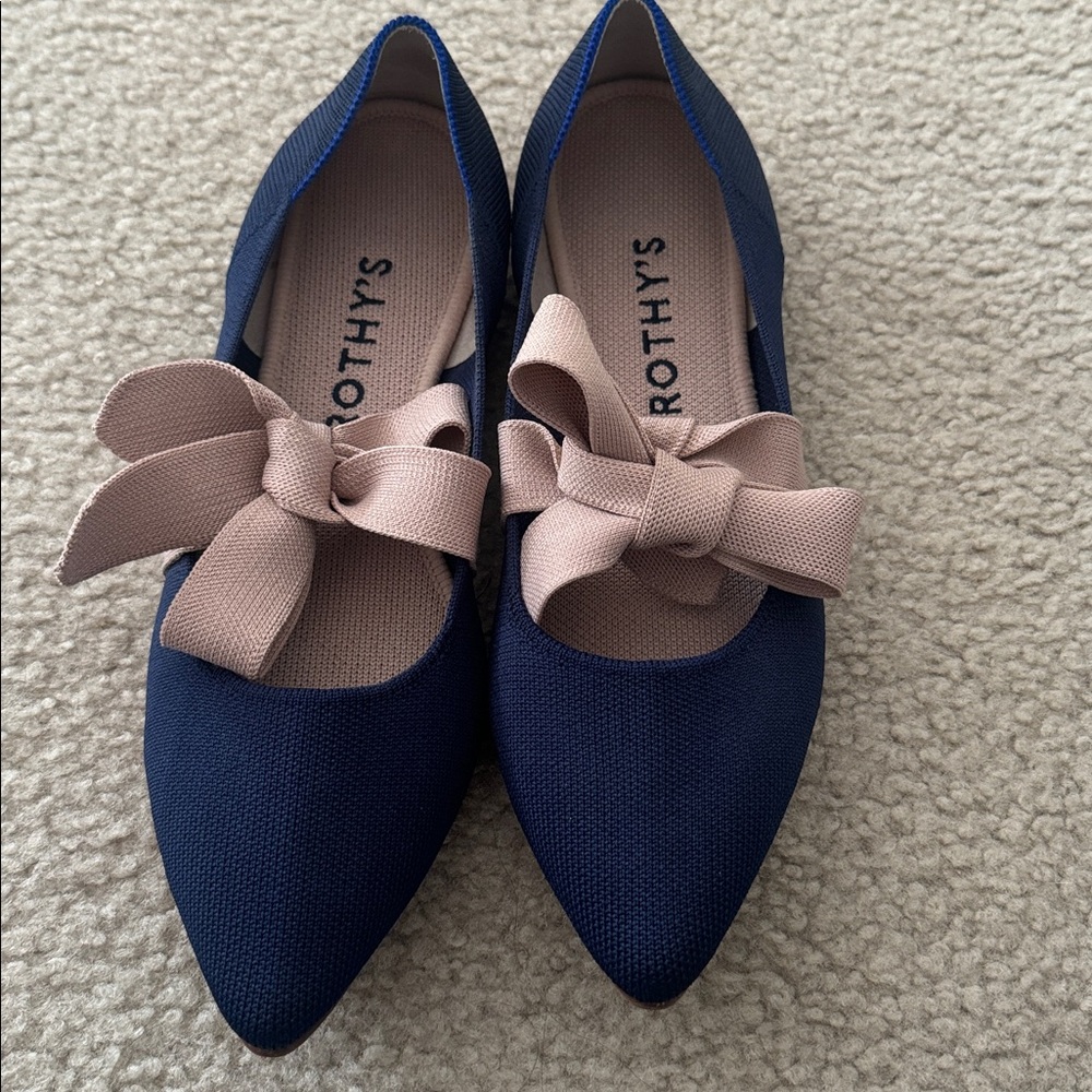 Rothy's Mary Jane The Point flat in sapphire blue with a pink bow